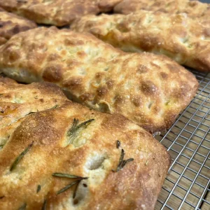 Golden brown rosemary focaccia bread by marvelli in park city
