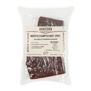 Jerky Hunters Reserve Reserve Champion Beef Jerky 2 Oz | Marvelli Artisan Breads Vacuum sealed beef jerky in clear plastic label reads hunters reserve and reserve champion beef jerky with notes about natural hardwood smoking and 9g protein per serving